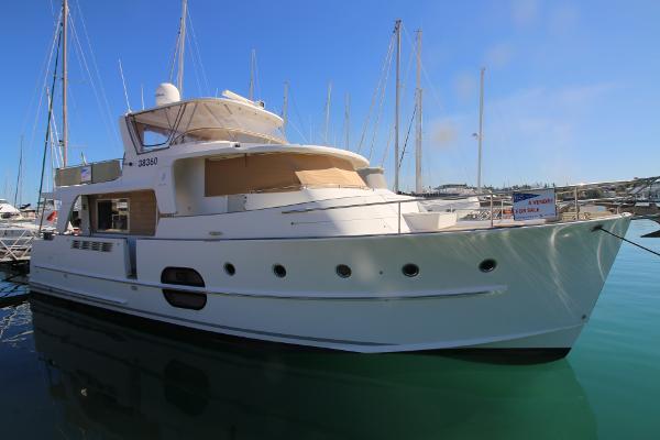 Beneteau Swift Trawler 52 2008 Beneteau Swift Trawler 52 docked in marina, clear blue sky background.