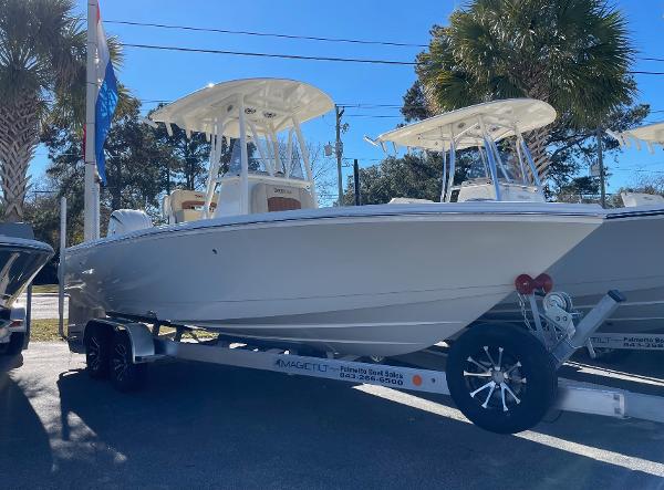 Pathfinder 2400 TRS 2024 Pathfinder 2400 TRS boat on trailer, displayed outdoors.