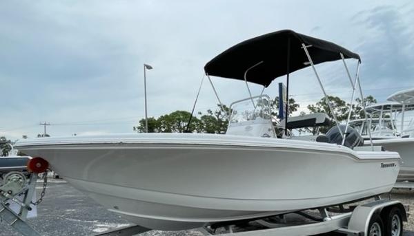 Tidewater 180CC 2024 Tidewater 180CC boat on trailer with canopy, parked outdoors.
