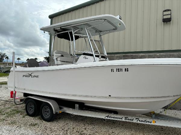 Pro-Line 23 Sport 2017 Pro-Line 23 Sport boat on trailer, parked outdoors.