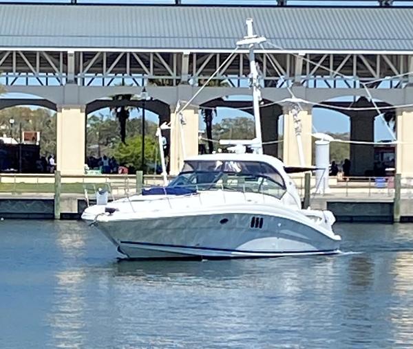 Sea Ray 44 Sundancer 2006 Sea Ray 44 Sundancer yacht docked near a marina.