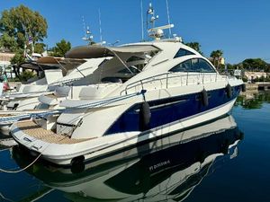 Fairline 52 Targa 2006 Fairline 52 Targa yacht docked in a marina, reflecting on calm water.