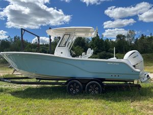 Sea Fox 248 Commander 2025 Sea Fox 248 Commander boat on trailer, parked on grass under blue sky.