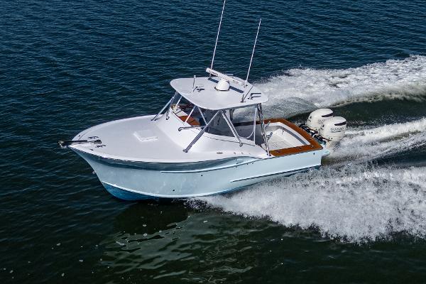 Custom Carolina Custom Express 2019 Custom Carolina Custom Express boat cruising on open water.