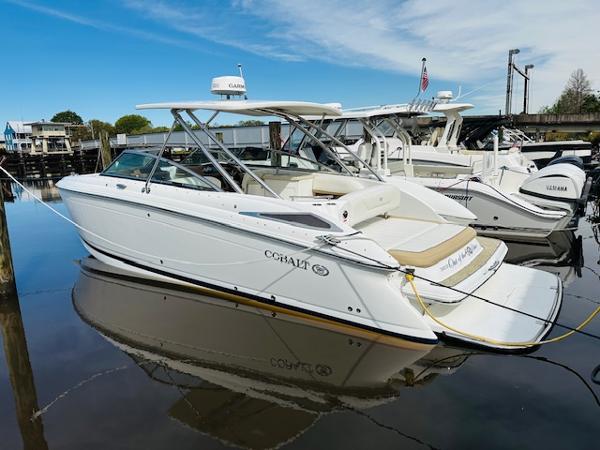 Cobalt 302 2015 Cobalt 302 boat docked in a marina on a sunny day.