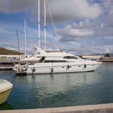 Mochi Craft MOCHI 56 1989 Mochi Craft MOCHI 56 yacht docked in a marina under a cloudy sky.