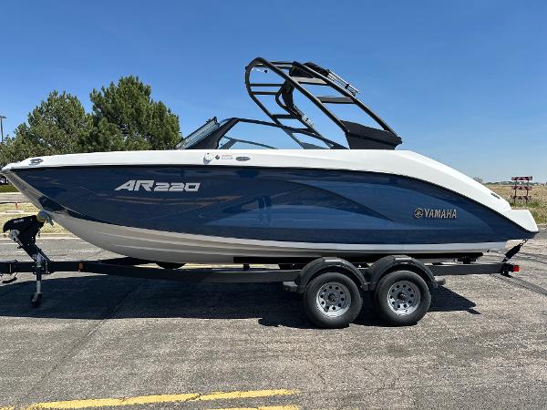 Yamaha Boats AR220 2025 Yamaha Boats AR220 on trailer, sleek design, blue and white color scheme.