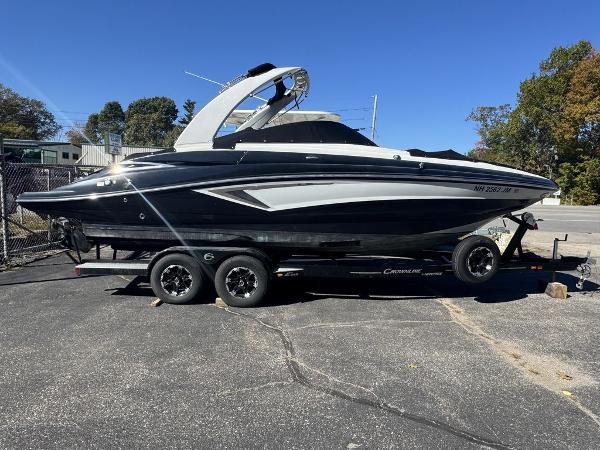 Crownline E 255 2020 Crownline E 255 boat on trailer, parked outdoors.