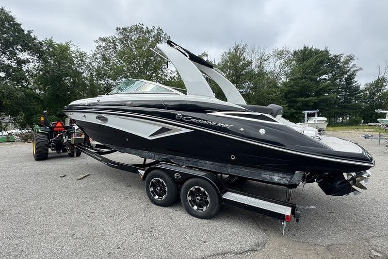 Crownline Eclipse E255 2020 Crownline Eclipse E255 boat on trailer, parked outdoors.