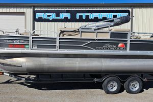 Sun Tracker Fishin' Barge 22 DLX 2016 Sun Tracker Fishin' Barge 22 DLX pontoon boat on trailer at Aqua Marine.