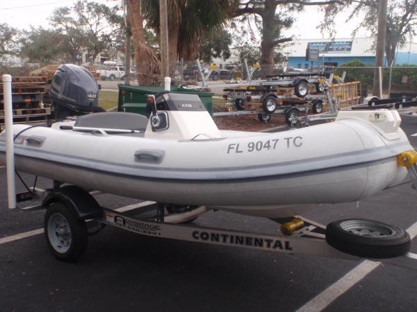 Northstar Axis 3.4 2021 Northstar Axis 3.4 inflatable boat on a Continental trailer in a parking lot.