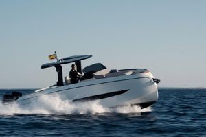 Kumbra 34 2026 Kumbra 36 boat cruising on open water, sleek design, clear sky.