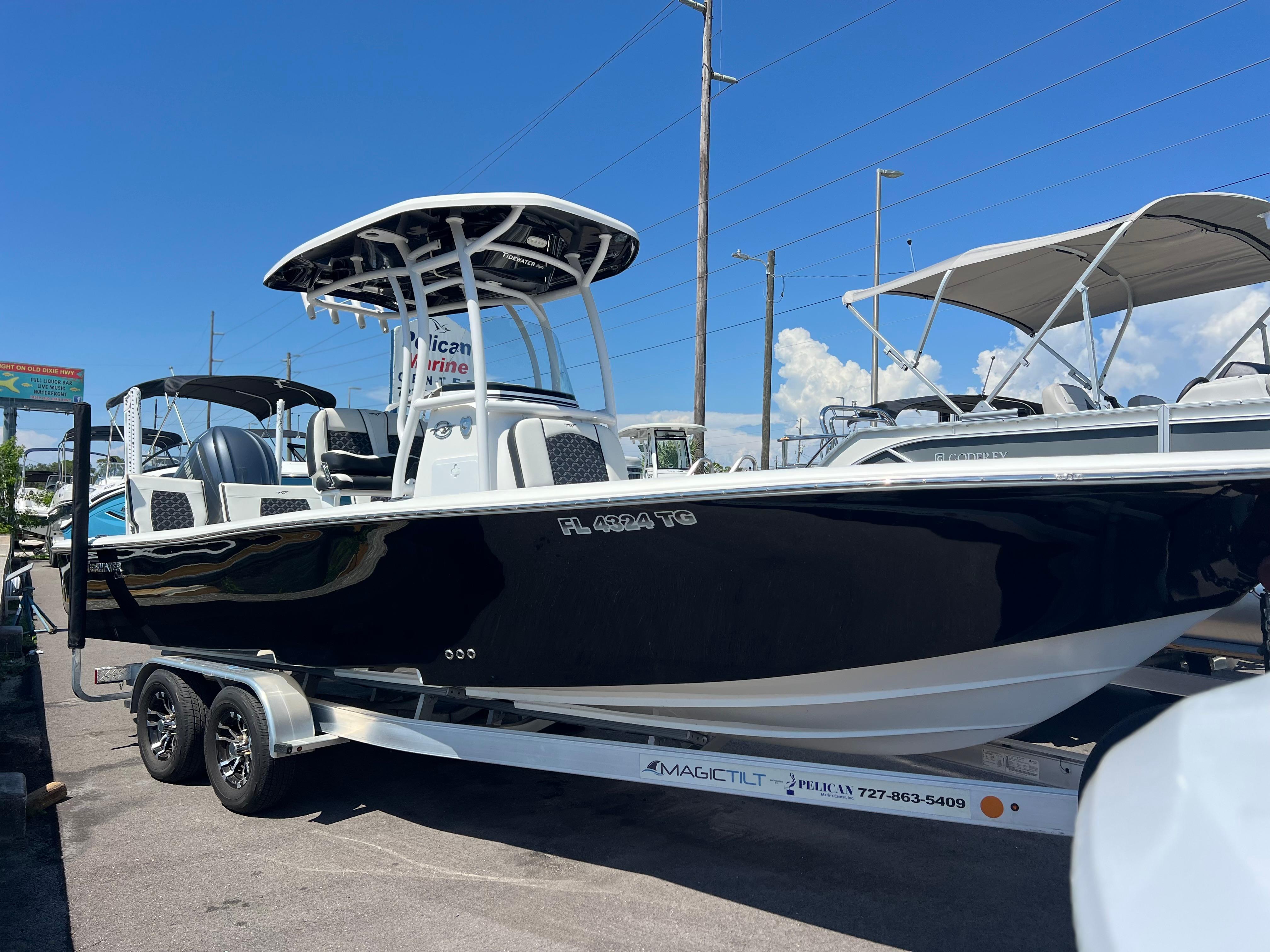 Tidewater 2500 Carolina Bay 2022 Tidewater 2500 Carolina Bay boat on trailer, black hull, sunny day.