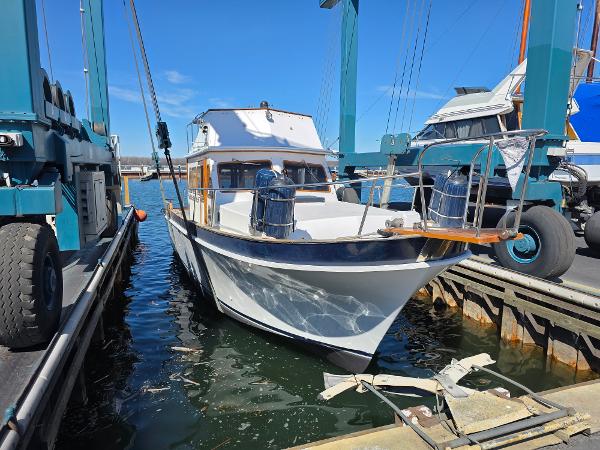 Californian 34 LRC 1978 Californian 34 LRC boat docked at marina under clear blue sky.
