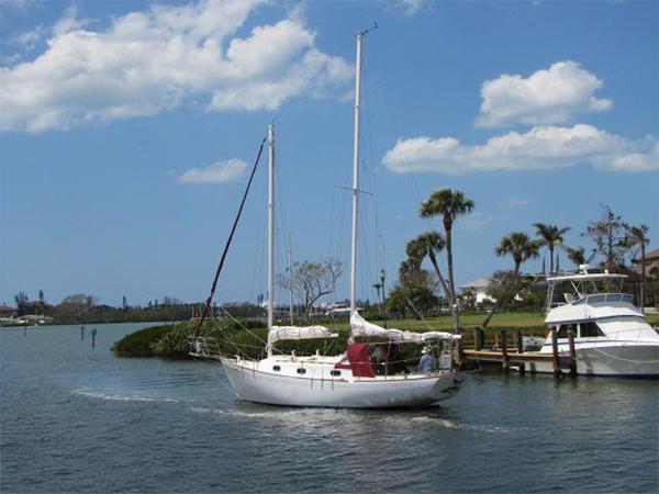 Custom Lazy Jack 32 1974 Custom Lazy Jack 32 sailboat cruising on a sunny day with palm trees in the background.