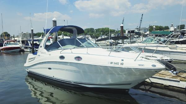 Sea Ray 260 Sundancer 2008 Sea Ray 260 Sundancer docked at marina under clear sky.