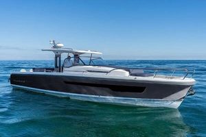 Nimbus T11 X-Edition 2023 Nimbus T11 X-Edition boat cruising on open water under clear blue skies.