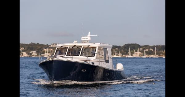 True North 39 Outboard Express 2025 True North 39 Outboard Express cruising on a calm lake.