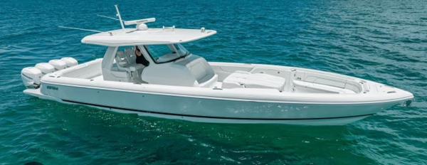 Intrepid 427 Nomad FE 2023 Intrepid 427 Nomad FE boat cruising on clear blue water.