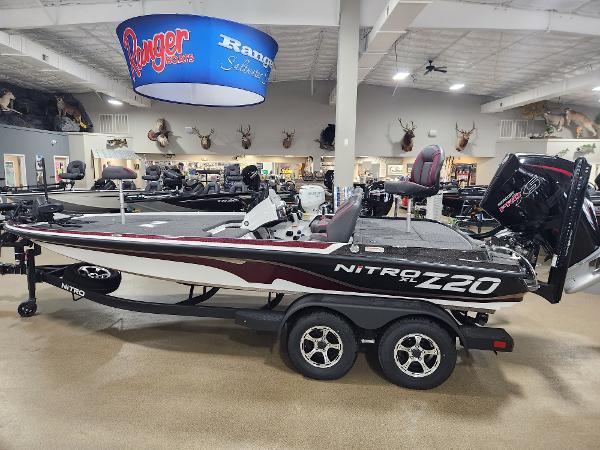 Nitro Z20 XL Pro 2025 Nitro Z20 XL Pro boat displayed in showroom with mounted motor.