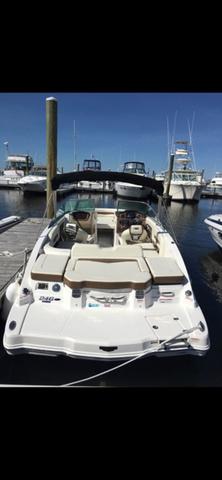 Chaparral 246 SSi 2017 Chaparral 246 SSi boat docked at marina, rear view.