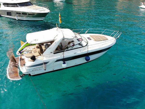 Bavaria Sport 35 2013 Bavaria Sport 35 yacht on clear turquoise water, anchored near other boats.
