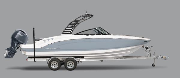 Chaparral 23 SSi OB 2025 Chaparral 23 SSi OB boat on trailer, side view, gray background.