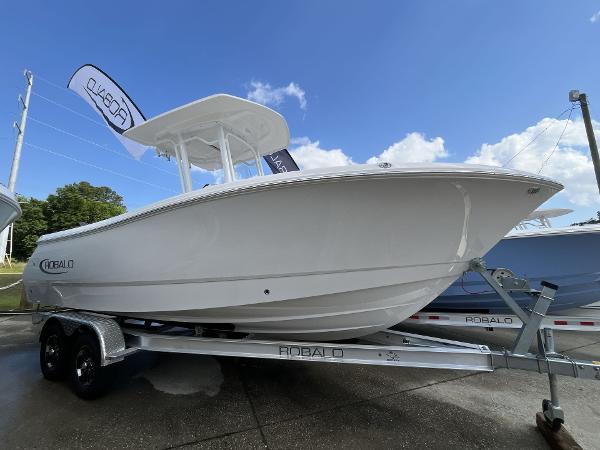 Robalo R230 Center Console 2024 Robalo R230 Center Console boat on a trailer under a clear blue sky.