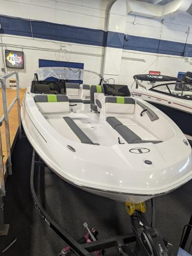 Tahoe T21 2024 Tahoe T21 boat with sleek design and modern seating in showroom.