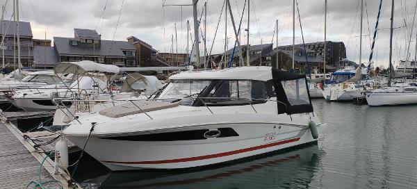 Beneteau Antares 8.80 OB 2016 Beneteau Antares 8.80 OB docked in a marina with other boats.
