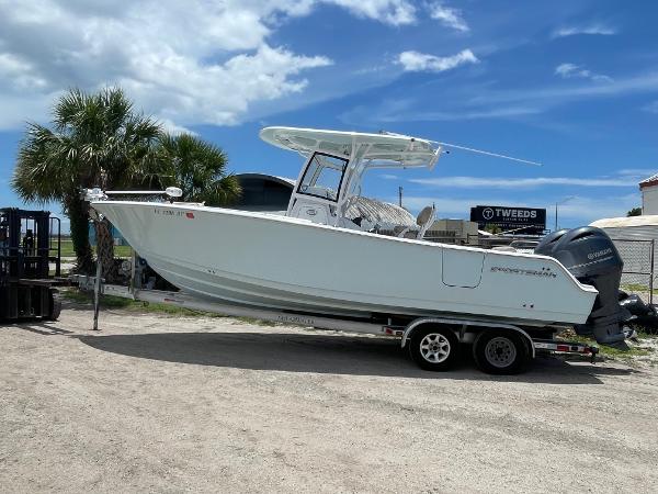Sportsman Open 252 Center Console 2020 Sportsman Open 252 Center Console boat on trailer, parked outdoors.