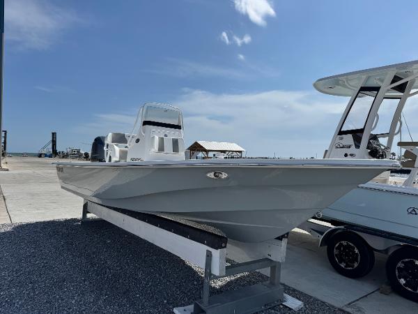 Frontier 2104 2025 Frontier 2104 boat on display, sleek design, parked on a trailer under a clear sky.