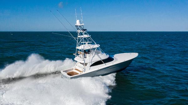 Viking 54 Convertible 2025 Viking 54 Convertible yacht cruising on open water.