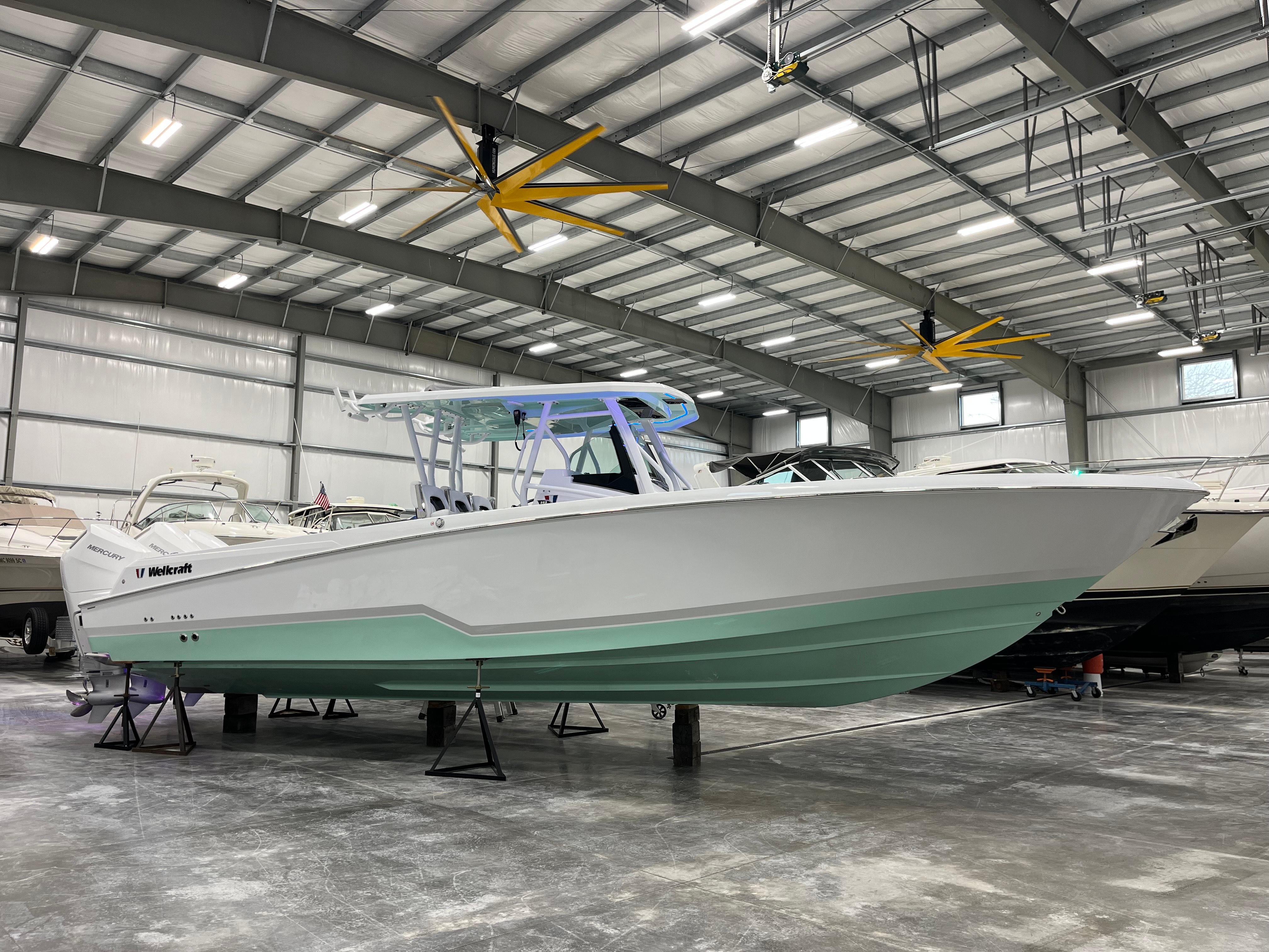 Wellcraft 352 Fisherman 2026 Wellcraft 352 Fisherman boat in a spacious indoor showroom.