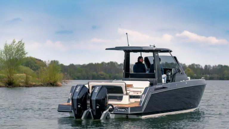 Schaefer V33 2025 Schaefer V33 boat with dual outboard engines on a lake.