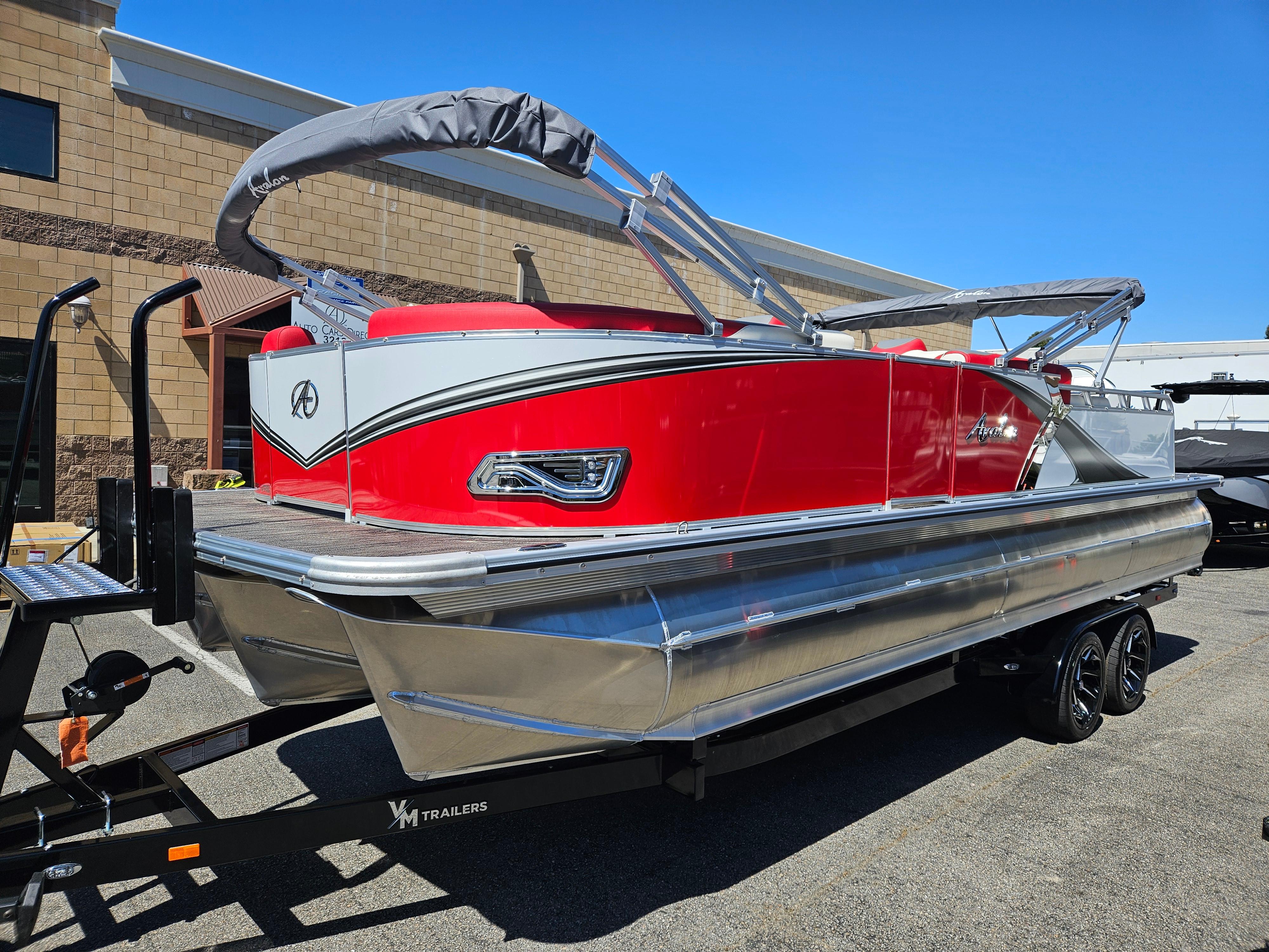 Avalon LSZ Versatile Rear Bench 25FT 2024 Avalon LSZ Versatile Rear Bench 25FT pontoon boat on trailer, vibrant red exterior.