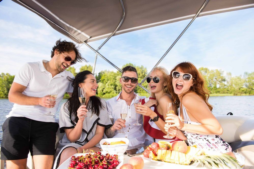 Friends celebrating on yacht